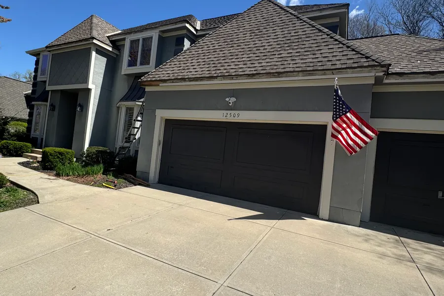 modern-house-concrete-driveway-shingle-roof-patriot-pro-exteriors-kansas-city-309963ea-5899-45e9-93d0-8cc8e4339bde_original